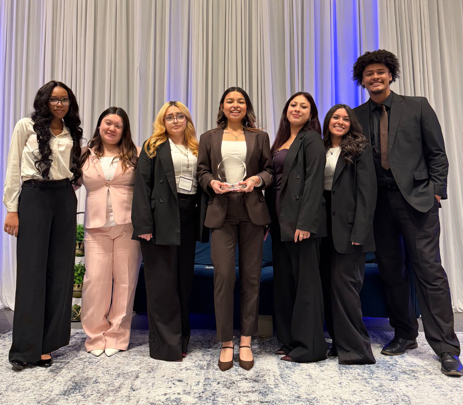 Cycle of Marketing team receiving an award